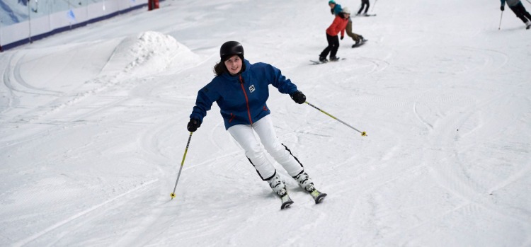 Woman skiing at indoor ski slope near London
